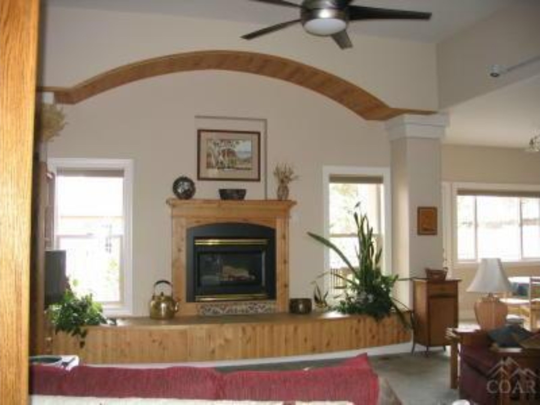 Living room with stone fireplace, 39th St, Central Oregon