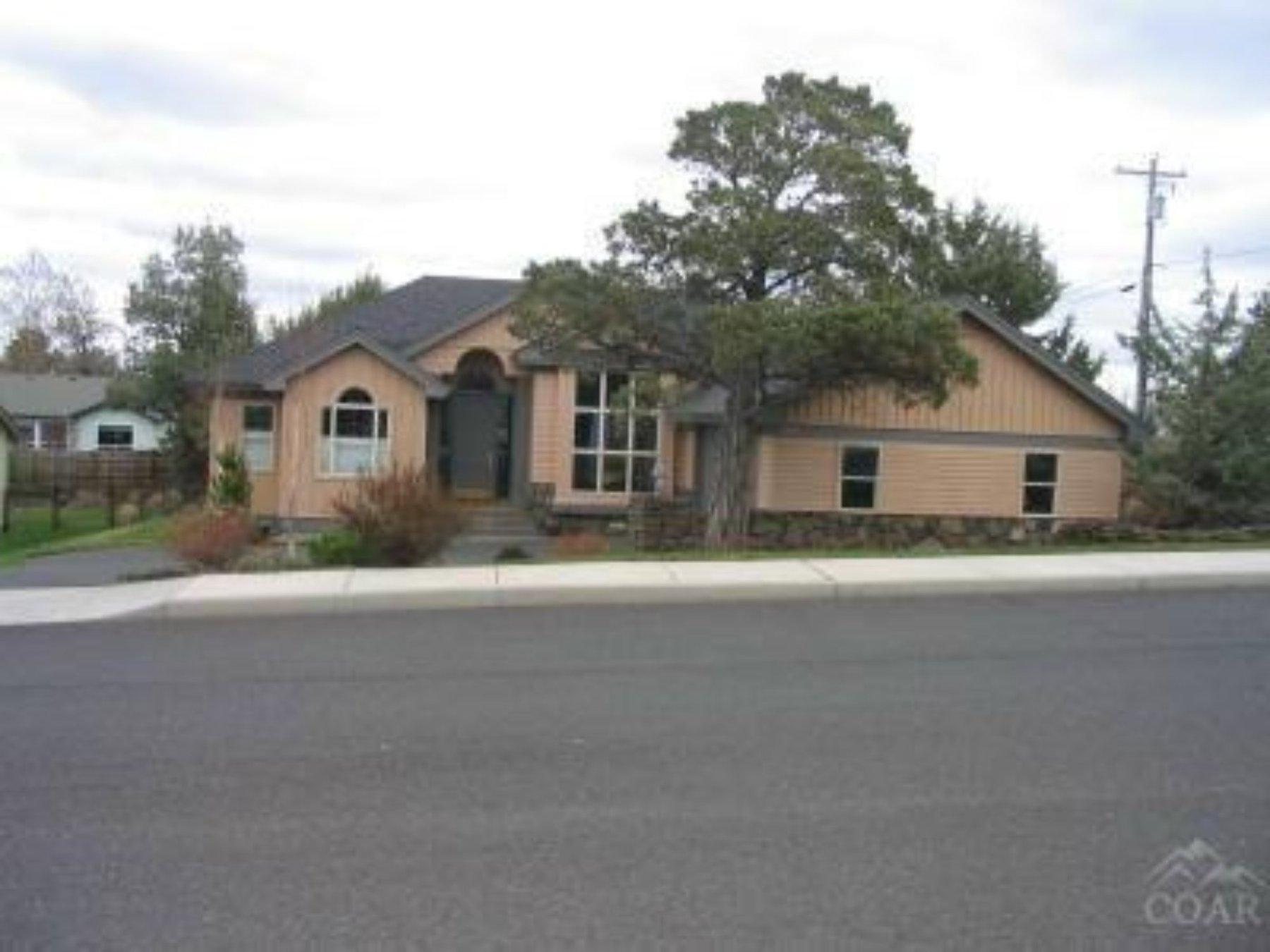 Single-story custom home exterior, 39th St, Central Oregon