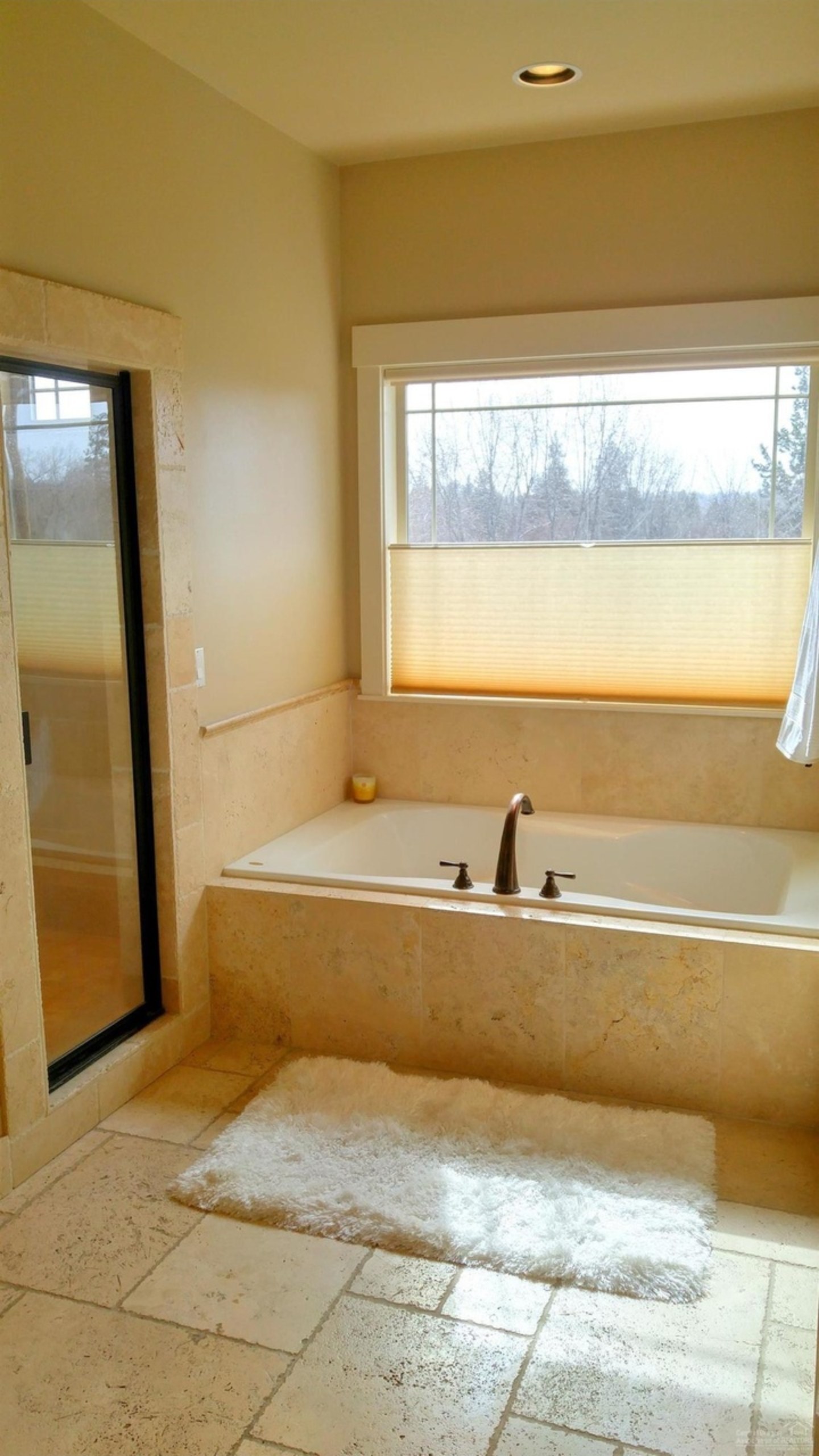Primary bathroom with soaking tub and window view, 9th St, Central Oregon