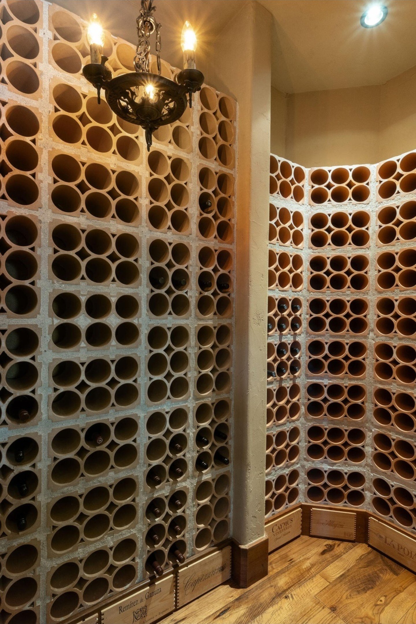 Custom wine cellar with stone walls and curved racking, Brushline Ct, Pronghorn, Bend, Oregon