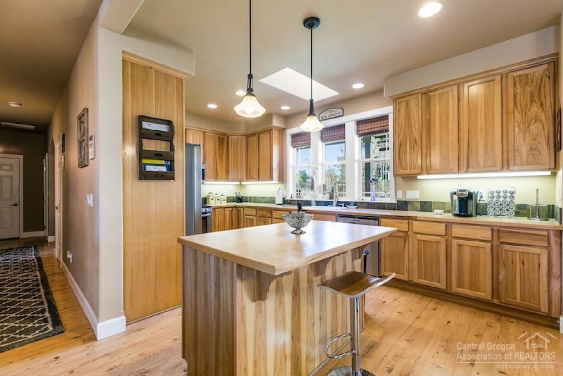 Kitchen with wood cabinetry and island, Rimrock, Central Oregon