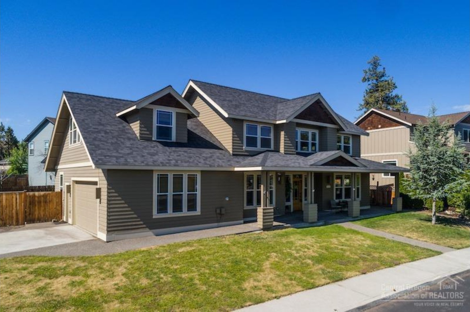 Craftsman style home with covered porch and gable roof, Rimrock, Central Oregon
