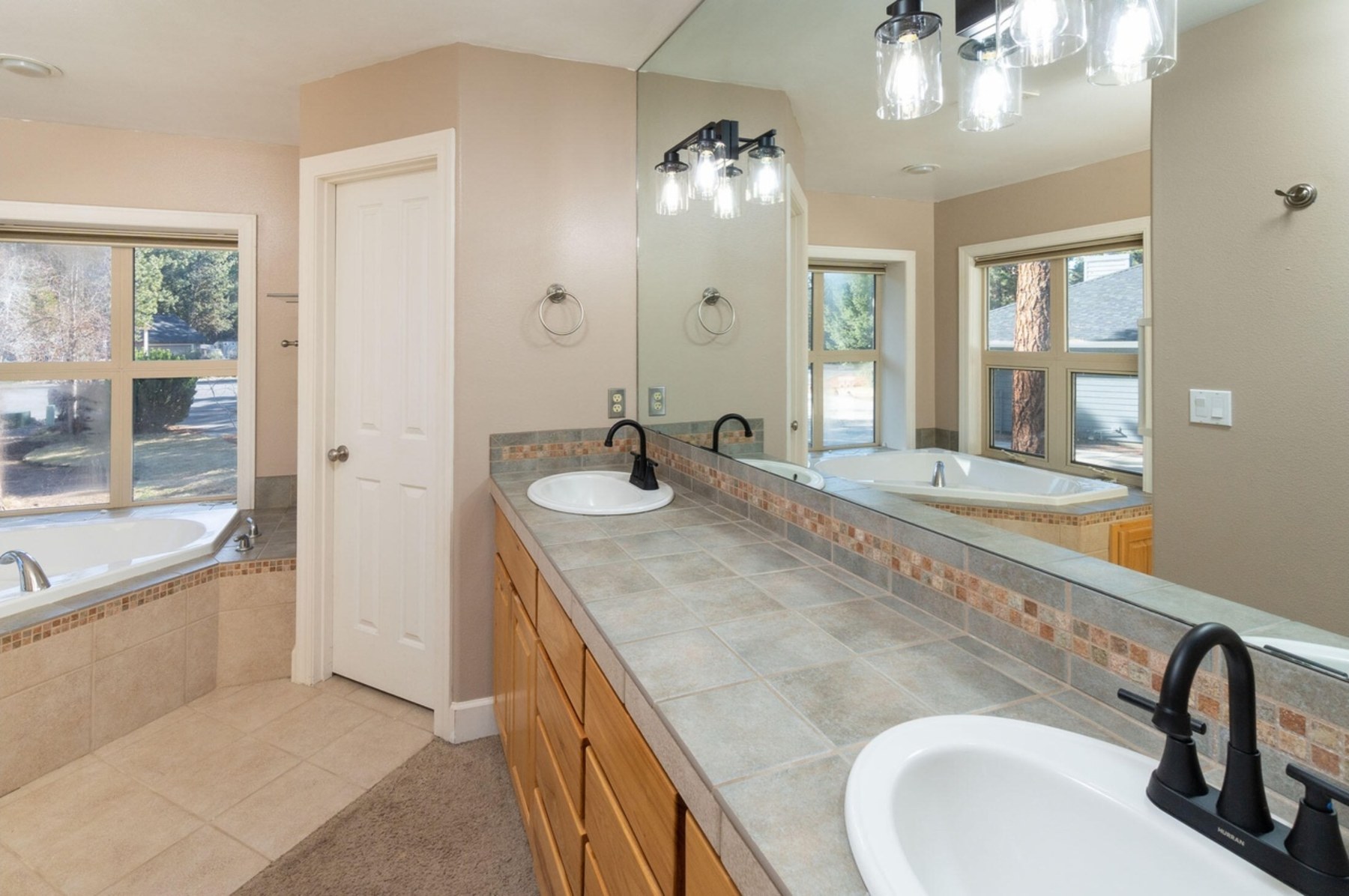 Primary bathroom with dual vanity and soaking tub, Zircon, Central Oregon