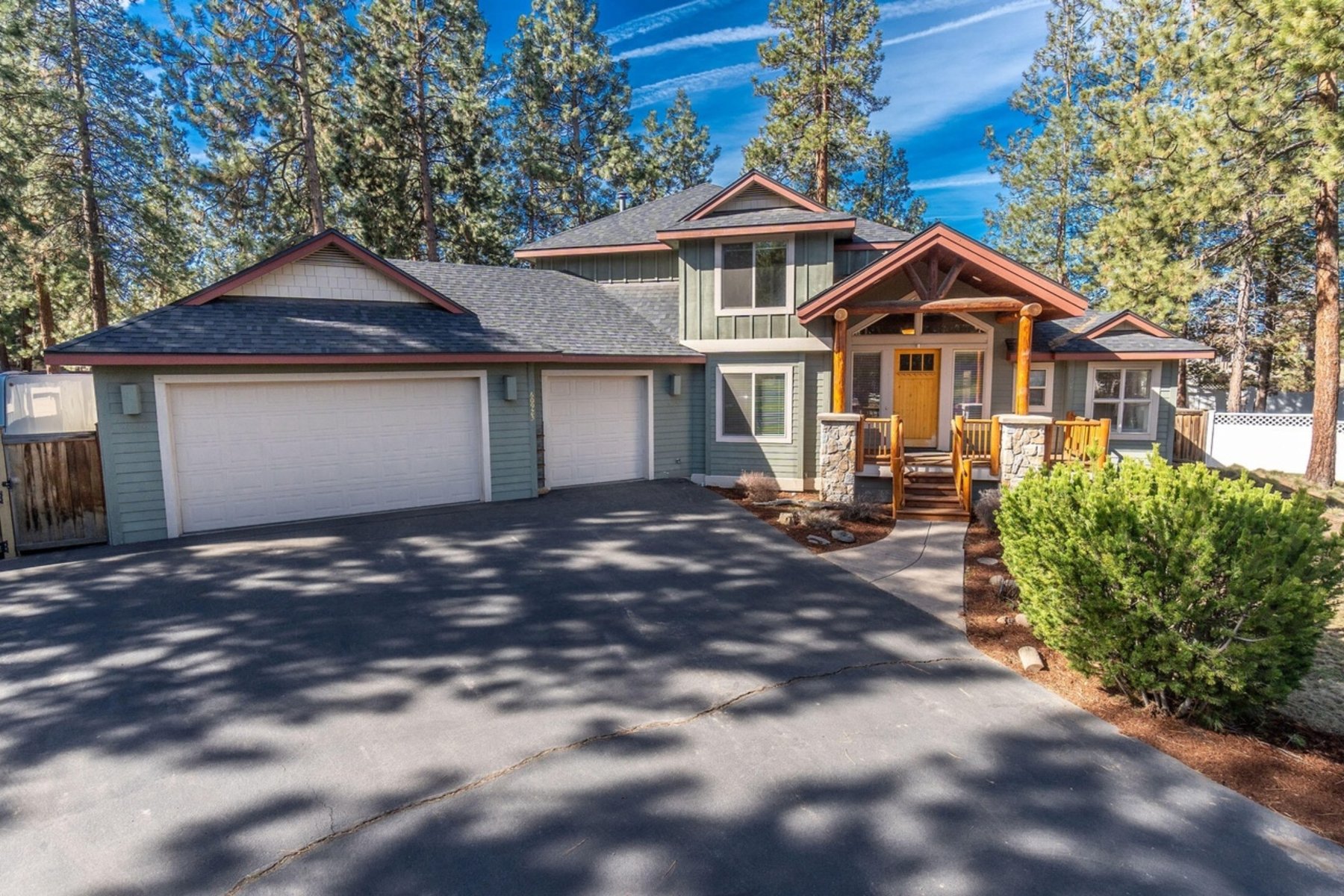 Two-story custom home with covered entry and garage, Zircon, Central Oregon